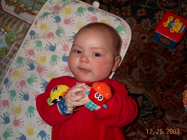 Charlotte with one of her stocking gifts.  She's nonplussed.