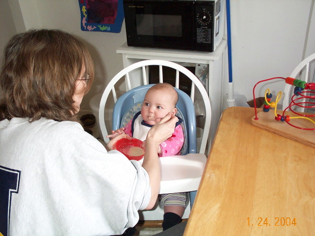 Charlotte's first feeding of solids.  Oatmeal is acceptable.